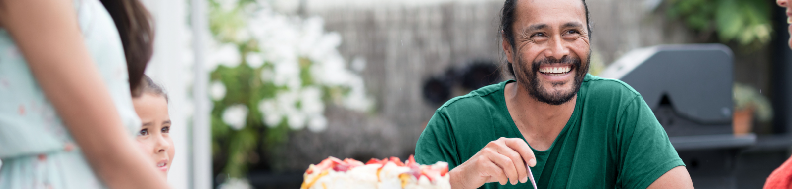 man eating cake on table